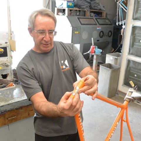 JB positions a head tube decal